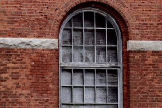 Windown in a Brick Wall. Photo by Jonathan Huggon.